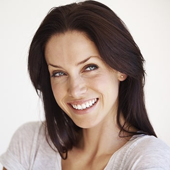 A woman with a whitened smile smiling